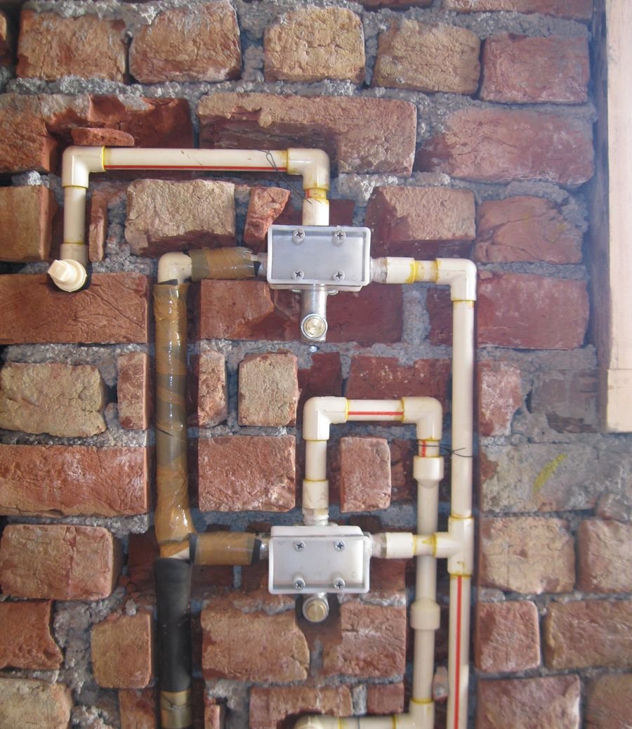 Concealed plumbing on a Swastik Buildtech site: valve covers and plugged outlets