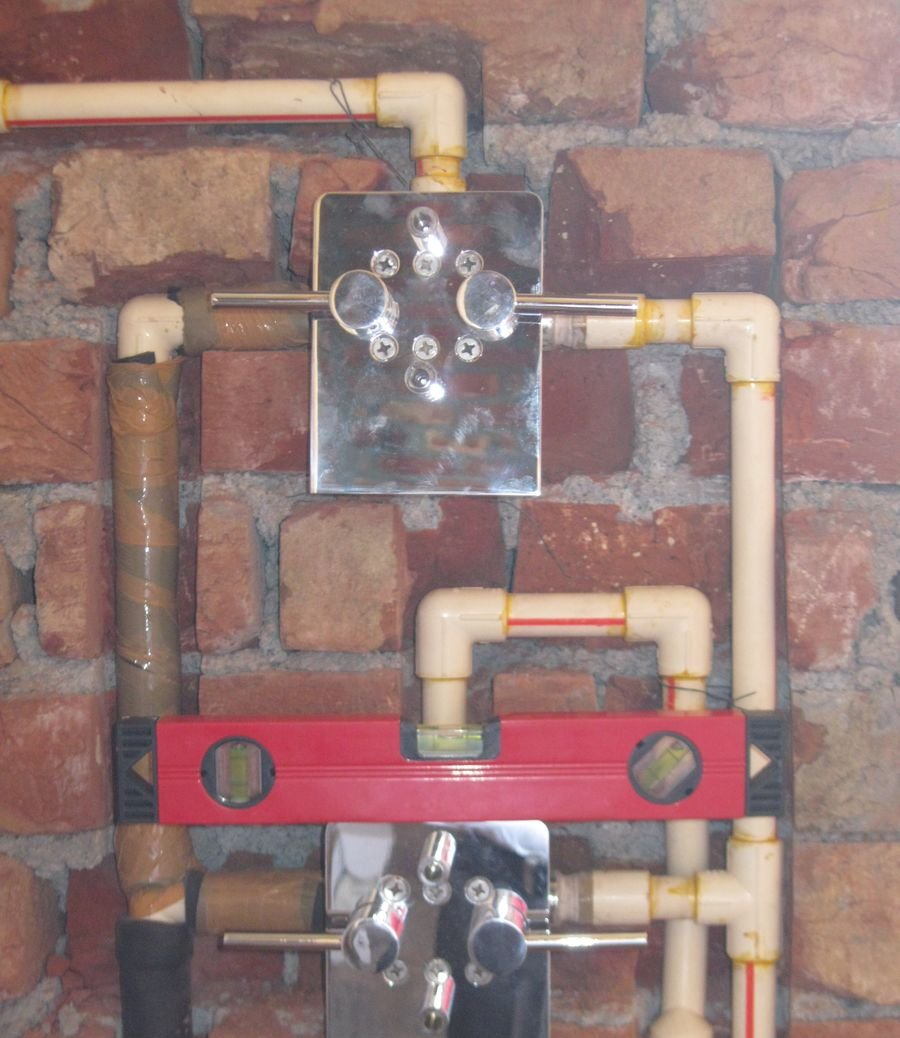 Concealed plumbing on a Swastik Buildtech site: spirit level check